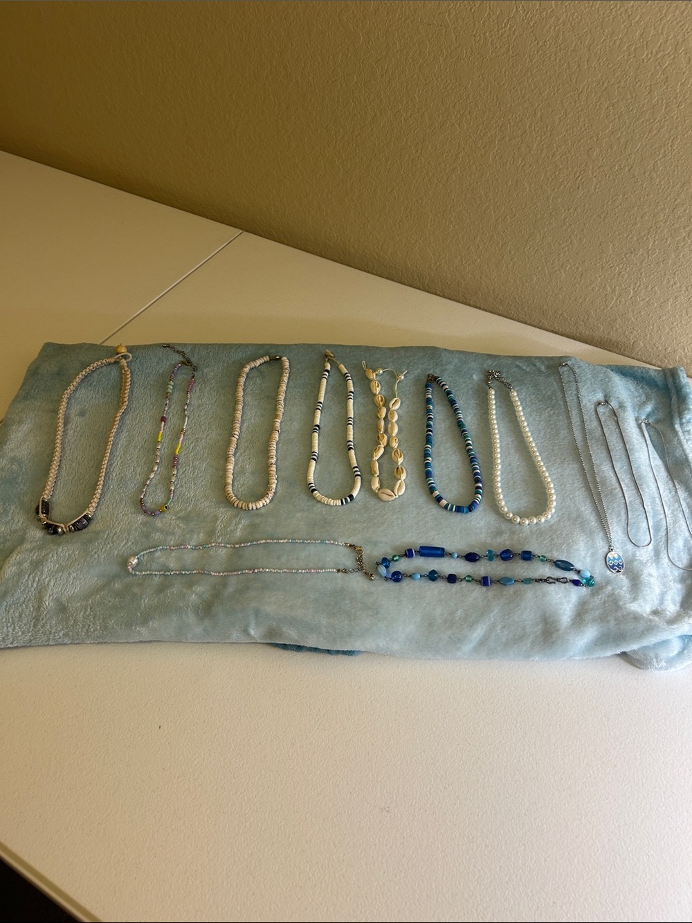 Assorted Beaded, Puka Shell and a Cowrie Shell Choker Necklaces. 12 Dif pcs